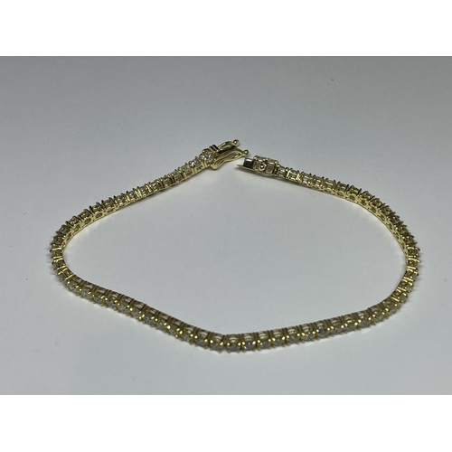 576 - A MARKED 14K TENNIS BRACELET WITH GEMOLOGY CARD IN A PRESENTATION BOX