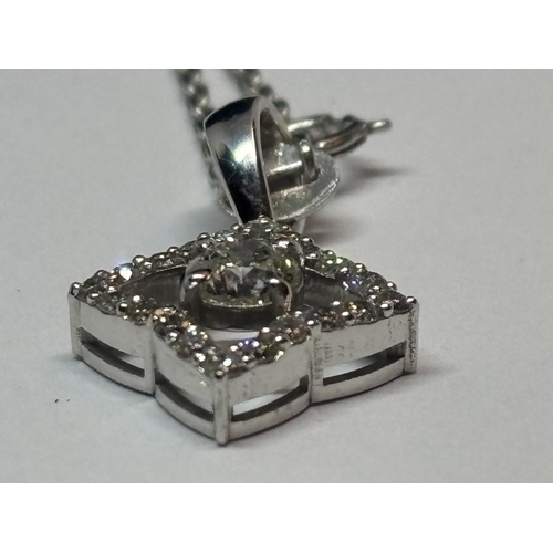 584 - AN 18 CARAT WHITE GOLD PENDANT WITH CHAIN, STUDDED WITH 0.44 CARATS OF ROUND BRILLIANT CUT NATURAL D... 