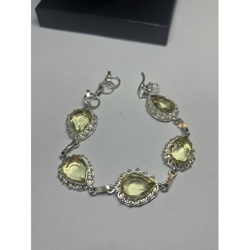 629 - A MARKED 925 SILVER BRACELET WITH LIME GREEN STONES