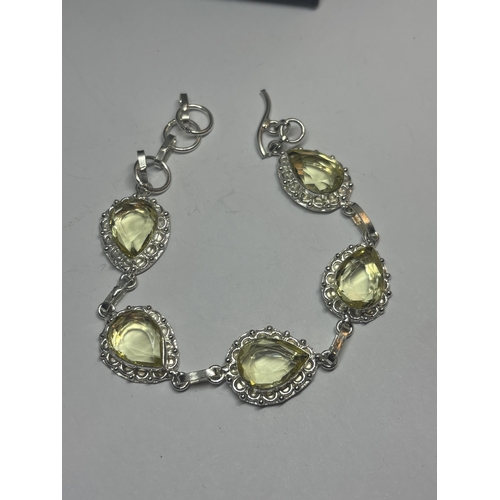 629 - A MARKED 925 SILVER BRACELET WITH LIME GREEN STONES