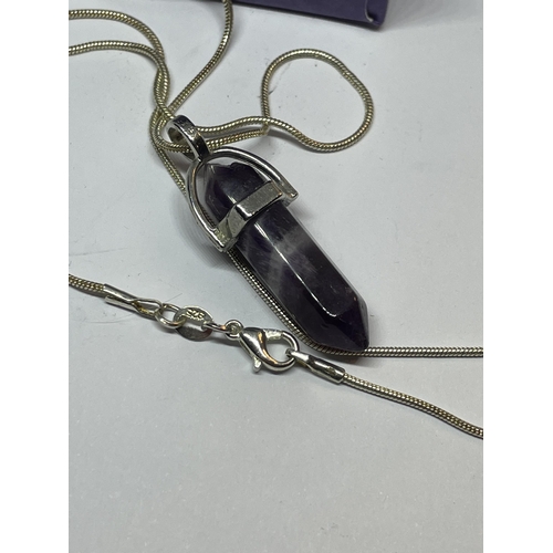 654 - A MARKED SILVER NECKLACE WITH PURPLE STONE PENDANT IN A PRESENTATION BOX