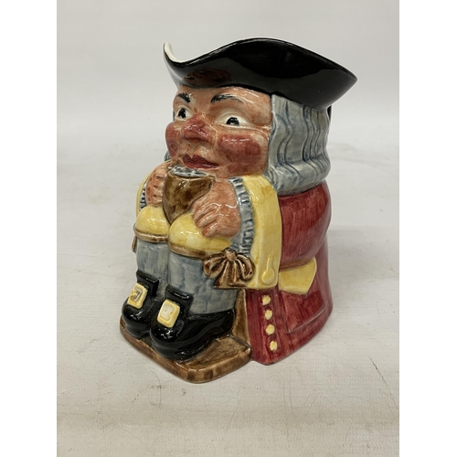 734 - A CLARICE CLIFF TOBY JUG MODELLED AS A SEATED GENT WITH FOAMING MUG PAINTED IN UNDERGLAZE COLOURS