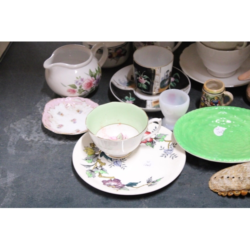 843 - A LARGE MIXED CERAMIC LOT TO INCLUDE JUGS, A TEAPOT, PARIAN WARE STYLE JUGS, ELEPHANT FIGURES, PLATE... 