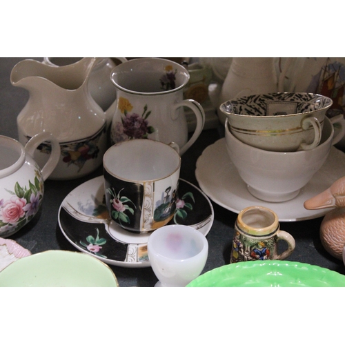 843 - A LARGE MIXED CERAMIC LOT TO INCLUDE JUGS, A TEAPOT, PARIAN WARE STYLE JUGS, ELEPHANT FIGURES, PLATE... 