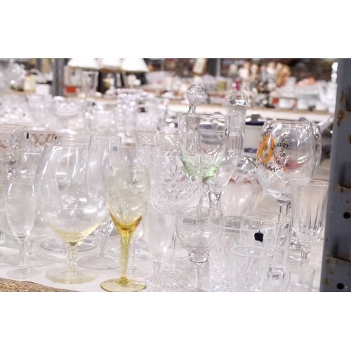 1002 - A VERY LARGE QUANTITY OF DRINKING GLASSES TO INCLUDE GIN, SHERRY, PORT, WINE, ETC., TOGETHER WITH TW... 