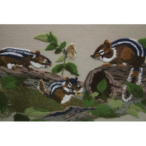 1018 - A FRAMED TAPESTRY OF A DOG TOGETHER WITH AN EMBROIDERY DEPICTING SQUIRRELS