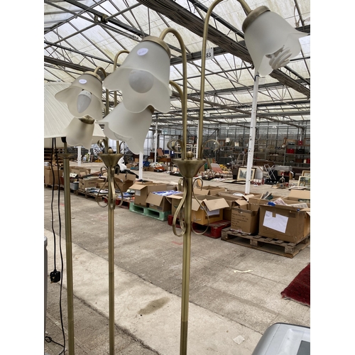 2410 - THREE BRASS EFFECT STANDARD LAMPS