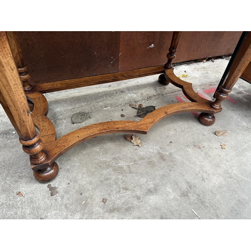 2501 - AN OAK GEORGIAN STYLE RENAISSANCE LOWBOY ENCLOSING THREE DRAWERS WITH TURNED TAPERING CHAMFERRED LEG... 