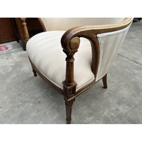 2505 - A LOUIS XVI STYLE LOUNGE CHAIR WITH SCROLL ARMS AND CURVED RACK ON TURNED AND FLUTED TAPERING FRONT ... 