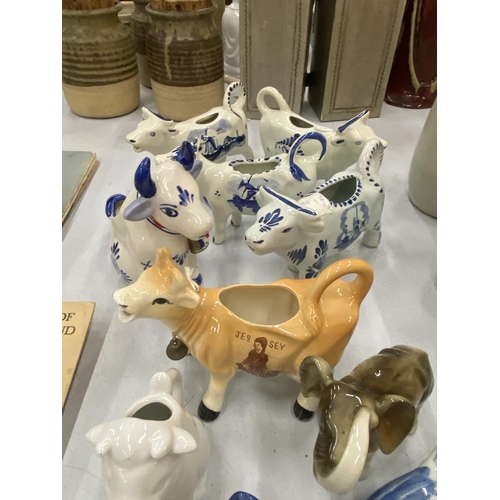 110 - A QUANTITY OF CERAMIC ANIMAL FIGURES TO INCLUDE VINTAGE 1960'S DUTCH DELFT BLUE HAND PAINTED COW CRE... 