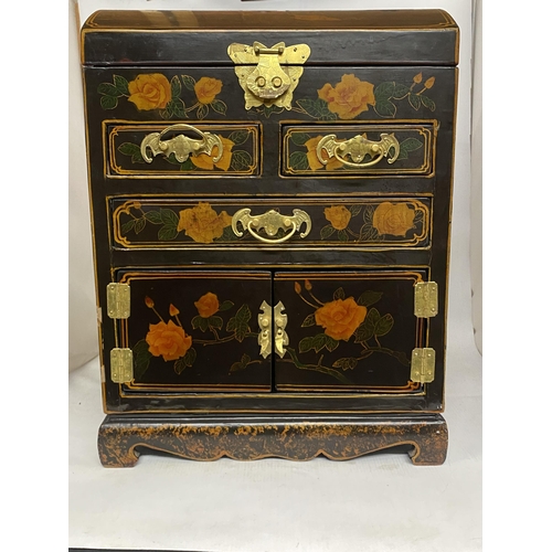 71 - A JAPANESE LACQUERED DOME TOP CASKET JEWELLERY CHEST WITH BRASS HANDLES/HINGES AND REFINED FLORAL DE... 