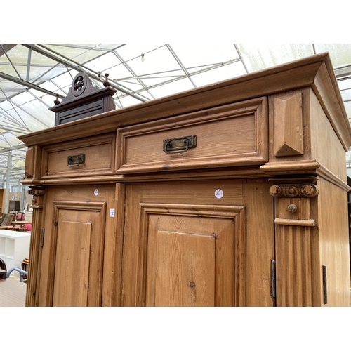 2546 - A PINE TWO DOOR PANELLED BEDROOM CUPBOARD WITH TWO DRAWERS 39