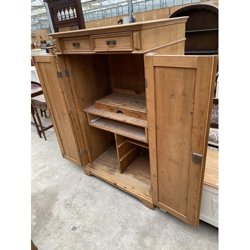 2546 - A PINE TWO DOOR PANELLED BEDROOM CUPBOARD WITH TWO DRAWERS 39