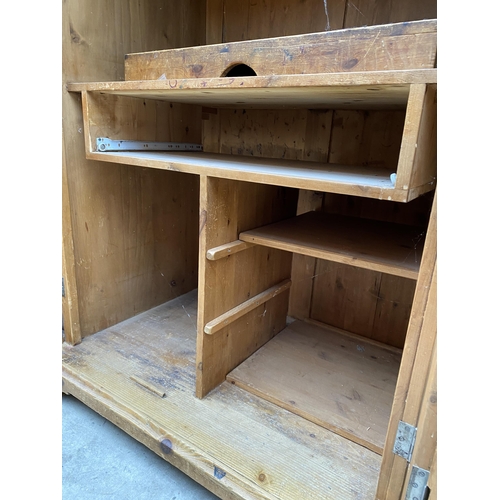 2546 - A PINE TWO DOOR PANELLED BEDROOM CUPBOARD WITH TWO DRAWERS 39