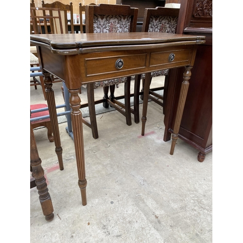 2548 - A MAHOGANY FOLD OVER GAME TABLE WITH TWO SHAM DRAWERS ON TURNED AND FLUTED LEGS 31