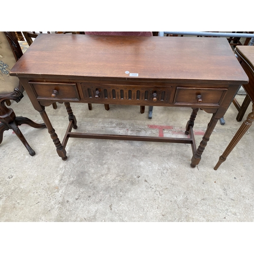 2549 - A OAK JACOBEAN STYLE THREE DRAWER SIDE TABLE 42