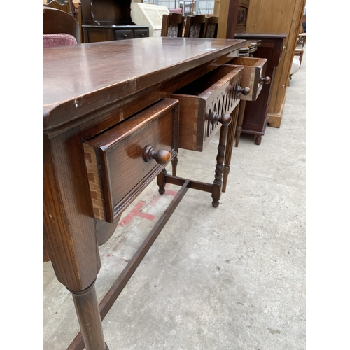 2549 - A OAK JACOBEAN STYLE THREE DRAWER SIDE TABLE 42