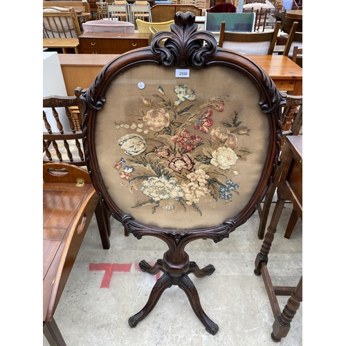 2550 - A VICTORIAN MAHOGANY SCREEN ON PEDASTAL BASE WITH INSET FLORAL WOOLWORK DECORATION