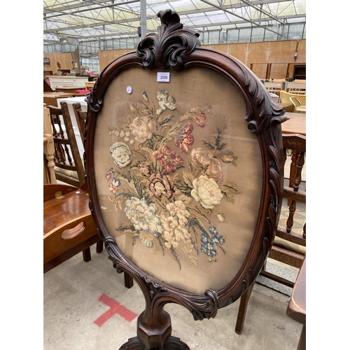 2550 - A VICTORIAN MAHOGANY SCREEN ON PEDASTAL BASE WITH INSET FLORAL WOOLWORK DECORATION