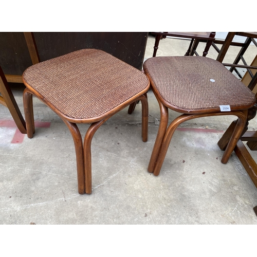 2554 - A PAIR OF WICKER AND BAMBOO EFFECT STOOLS