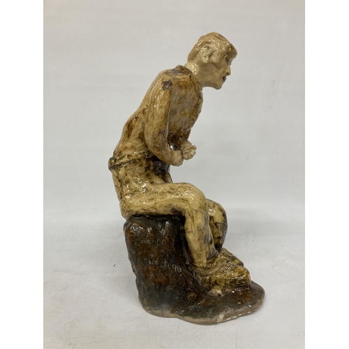 60 - A LARGE GLAZED POTTERY SCULPTURE OF A SEATED MAN, SIGNED FRANCO MONDSTERO, HEIGHT 44CM