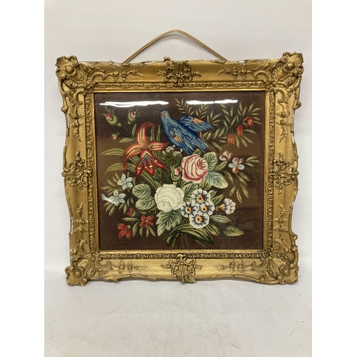 74 - A VINTAGE HAND EMBROIDERED NEEDLEWORK PICTURE OF A BIRD AND FLOWERS IN A GILT FRAME - FRAME A/F, 56C... 