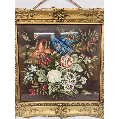 74 - A VINTAGE HAND EMBROIDERED NEEDLEWORK PICTURE OF A BIRD AND FLOWERS IN A GILT FRAME - FRAME A/F, 56C... 