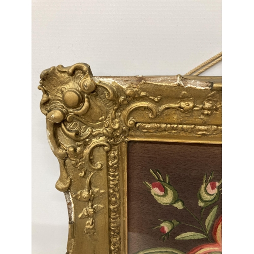 74 - A VINTAGE HAND EMBROIDERED NEEDLEWORK PICTURE OF A BIRD AND FLOWERS IN A GILT FRAME - FRAME A/F, 56C... 