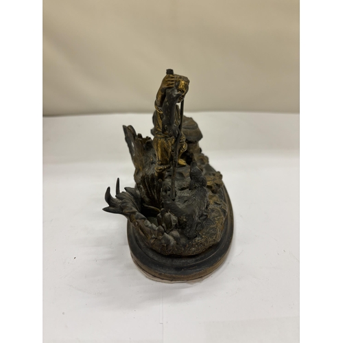 2 - AN ANTIQUE BRASS DESK INKWELL AND PEN STAND MODELLED AS A BOY AND DOG HUNTING, WIDTH 14CM, HEIGHT 10... 