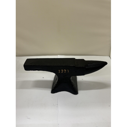 26 - A CAST SHELL MOTOR OIL ANVIL, HEIGHT 9CM, LENGTH 23CM