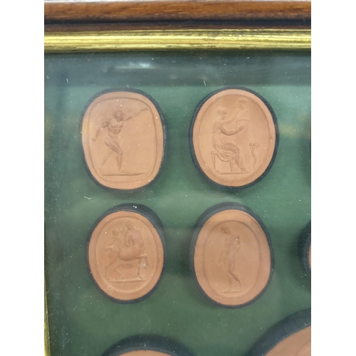 29 - A FRAMED SET OF INTAGLIOS