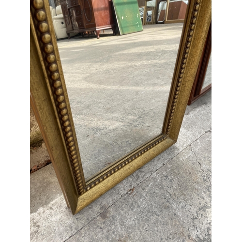 3033 - A GILT FRAMED WALL MIRROR WITH BEVEL EDGE, 52.5