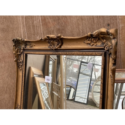 3054 - A GILT FRAMED WALL MIRROR, 31