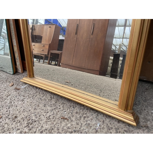 3057 - A GILT FRAMED OVERMANTEL BEVEL EDGE WALL MIRROR, 33