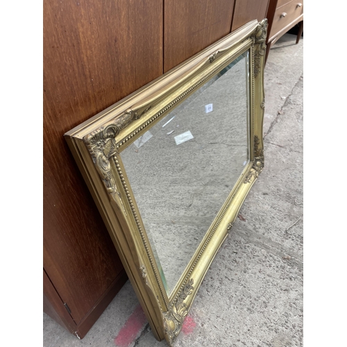 3058 - A GILT FRAMED BEVEL EDGE WALL MIRROR, 36