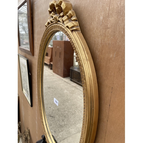 3066 - AN OVAL GILT FRAMED WALL MIRROR, 26