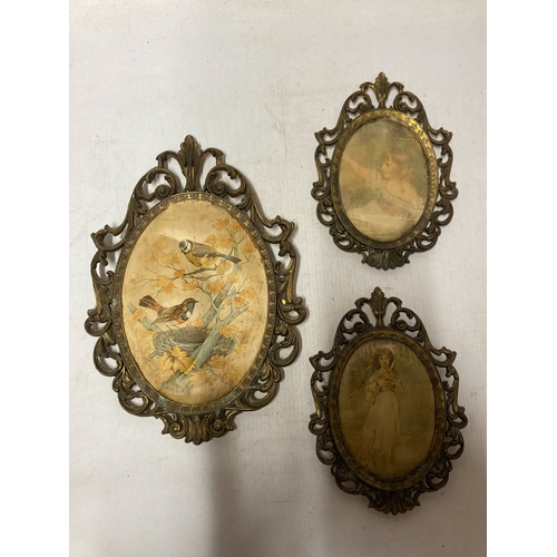 804 - THREE VINTAGE OVAL SILK PICTURES IN ORNATE BRASS FRAMES