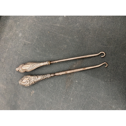 100A - TWO MARKED SILVER TOPPED BUTTON HOOKS