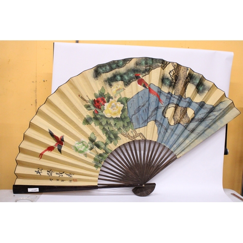 58 - A LARGE PAPER FAN WITH BIRD DECORATION, HEIGHT 98CM