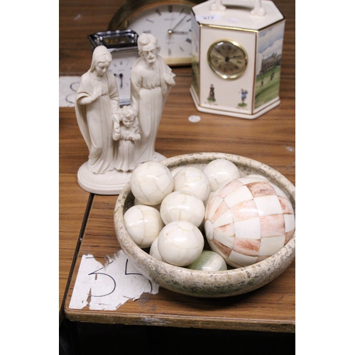 971 - A MARBLE STYLE BOWL CONTAINING A QUANTITY OF DECORATIVE BALLS AND AN ITALIAN FAMILY FIGURE GROUP