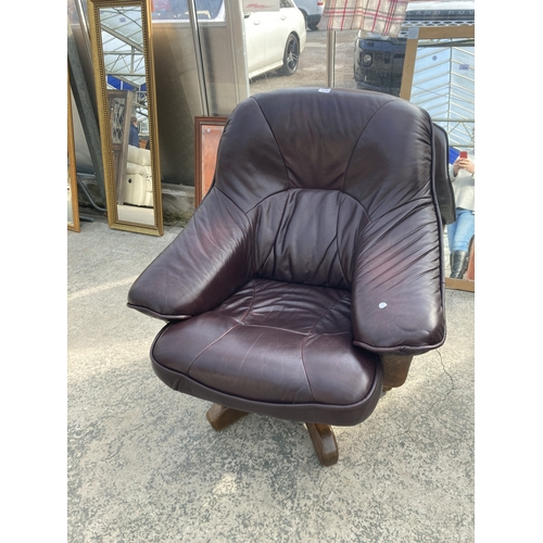 3118 - A BROWN LEATHER SWIVEL EASY CHAIR