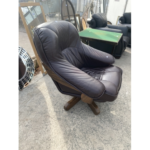 3118 - A BROWN LEATHER SWIVEL EASY CHAIR