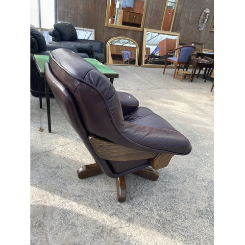 3118 - A BROWN LEATHER SWIVEL EASY CHAIR