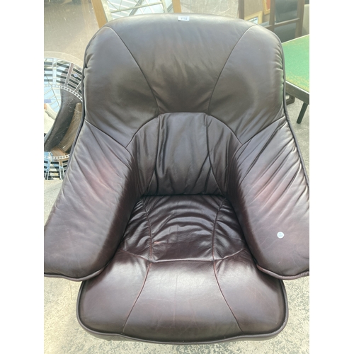 3118 - A BROWN LEATHER SWIVEL EASY CHAIR