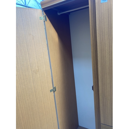 3159 - A TEAK EFFECT TWO DOOR WARDROBE, 35.5