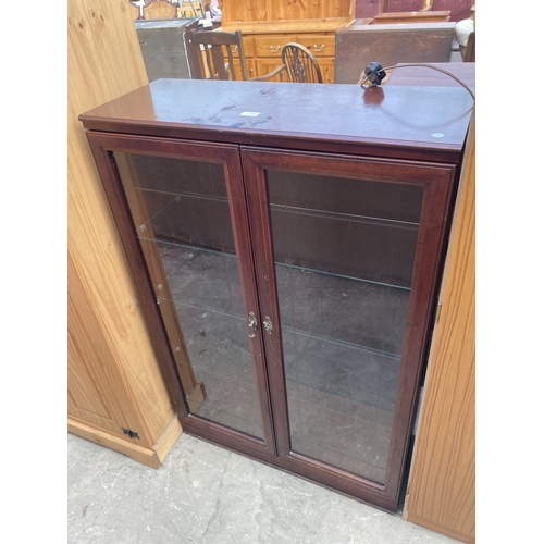 3160 - A MAHOGANY TWO DOOR BOOKCASE 32