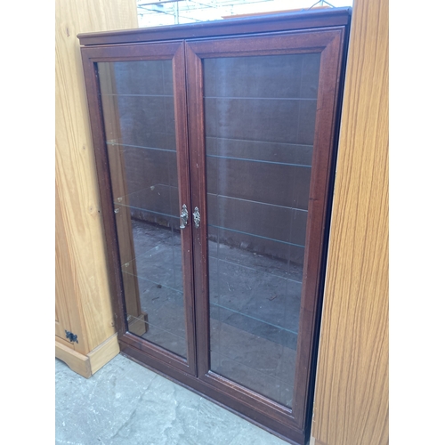 3160 - A MAHOGANY TWO DOOR BOOKCASE 32