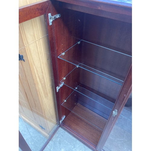 3160 - A MAHOGANY TWO DOOR BOOKCASE 32