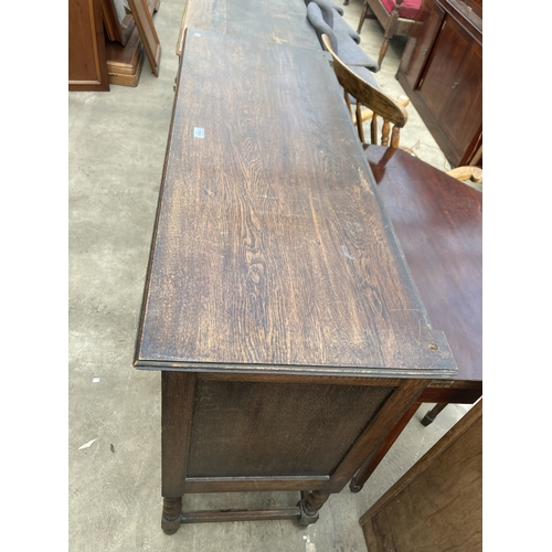 3164 - AN EARLY 20TH CENTURY OAK SIDEBOARD ON BARLEY TWIST LEGS 48