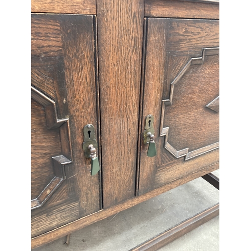 3164 - AN EARLY 20TH CENTURY OAK SIDEBOARD ON BARLEY TWIST LEGS 48